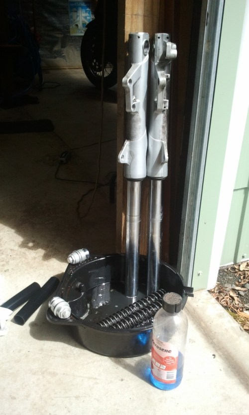 Draining the forks after a rinse with kerosene.